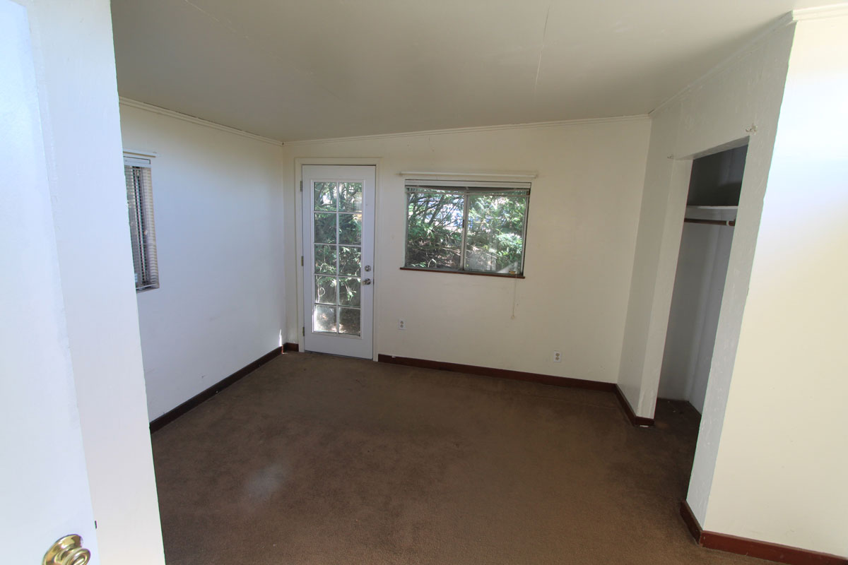 This is the master bedroom with an outside door.  It is in the far back of the house.