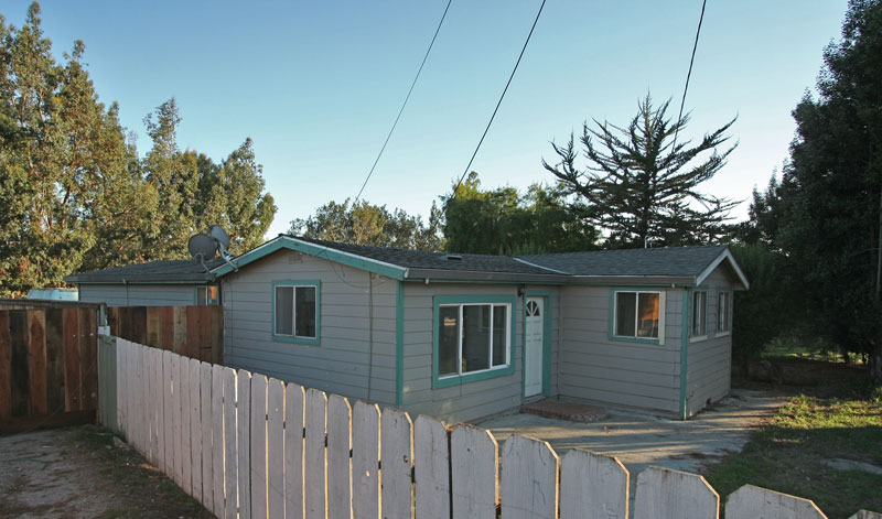 The front yard is fenced.  There is lots of parking behind the house and that yard is also fenced.  There is also covered parking in the back.