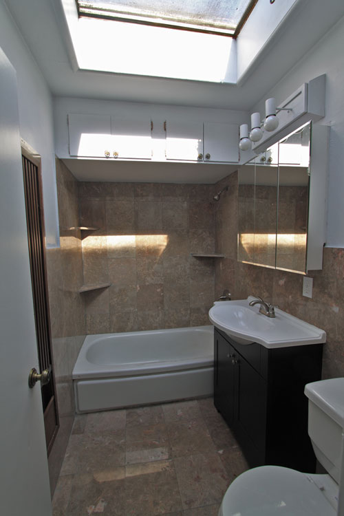 The master bath is all new with a skylight and marble throughout. 