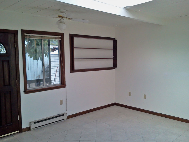 There is lots of light in the apartment.  The front door opens directly into the fenced yard. 