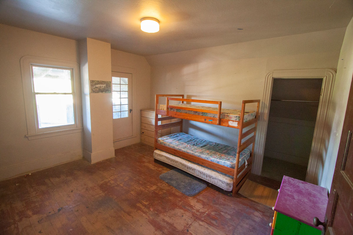 The back bedroom is also quite large (13' x 14') with lots of storage and a strange porch that I would not recommend using as it seems to be in poor shape.