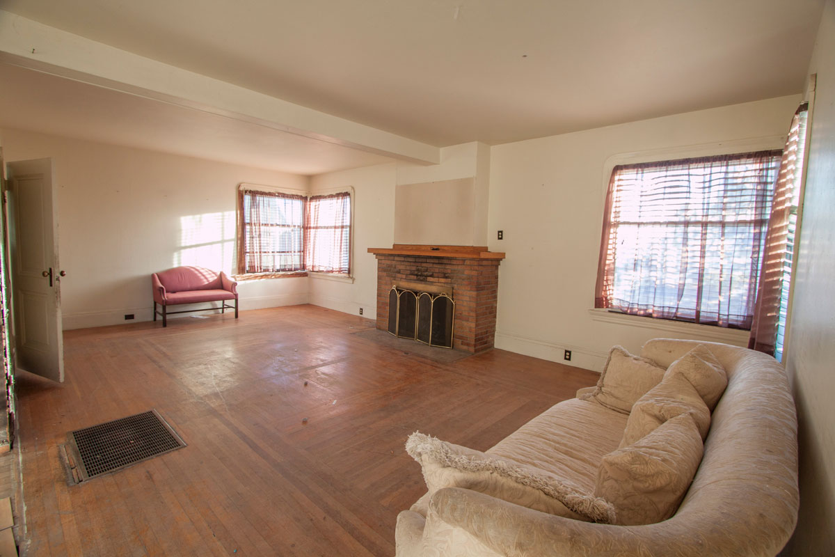 Large windows give plenty of light and the wood floor is usable.