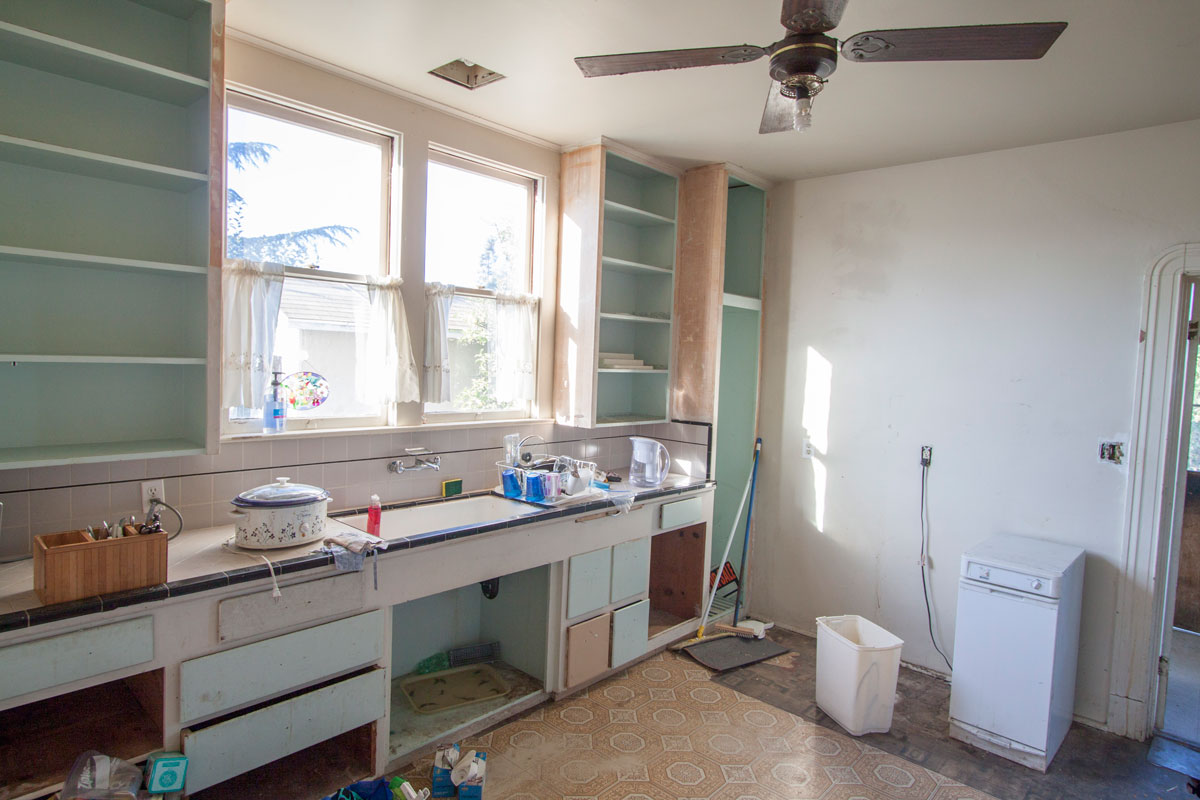 THe kitchen is interesting.  These cabinets all have doors which were removed for painting.  Lots of storage space here.  Trash compactor is included but no dishwasher has been installed.