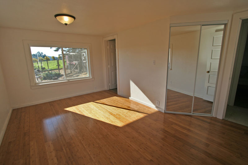 The master bedroom has bamboo flooring and great views.