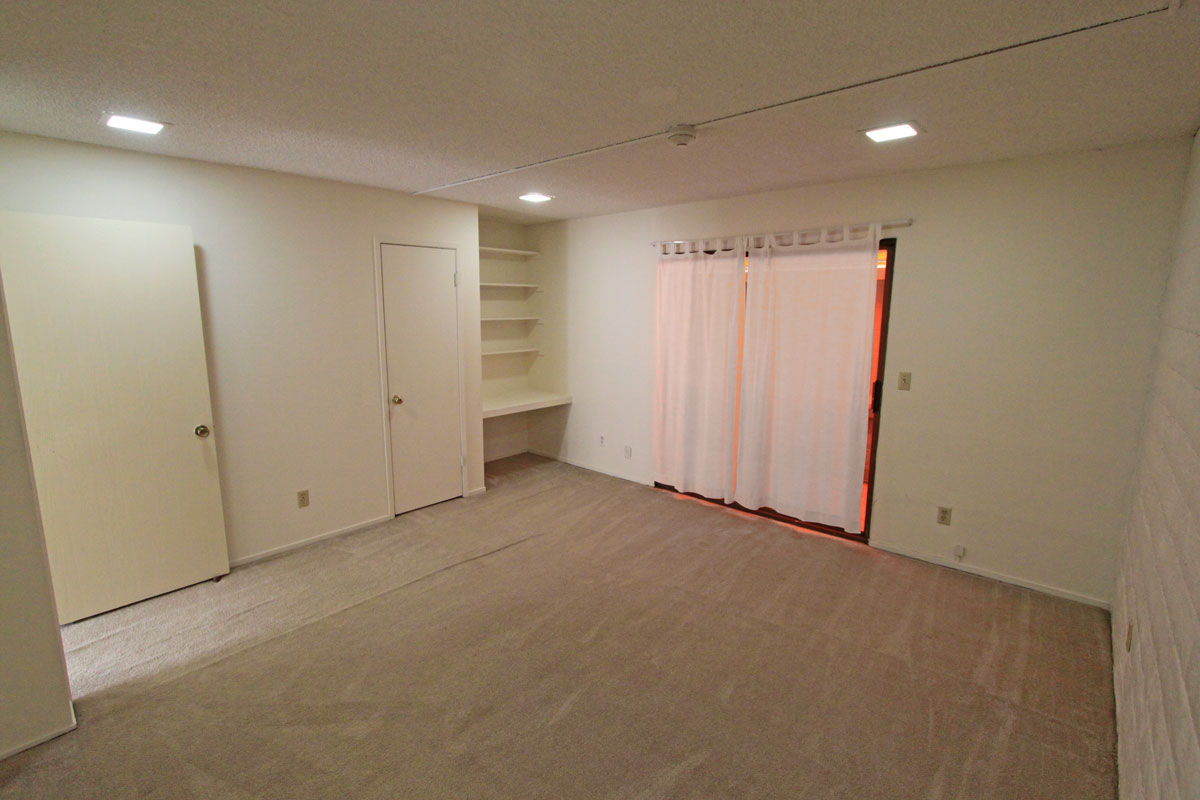 The bedroom is 14' x 14' with a closet and built-in desk and bookcase.