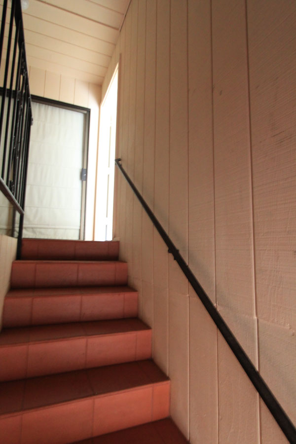 Go up the steps and it is the first door on your right - shown open