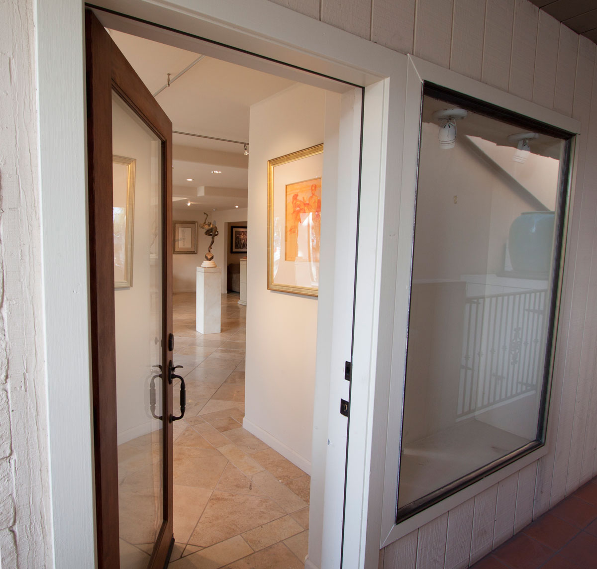 The front door opens on to a covered walk.  Close but protected from the weather.